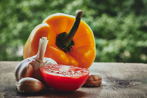 Pepper, half of tomato and garlic head - Foto, Imagen