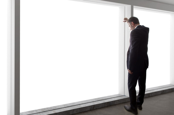 businessman looking out window - 写真・画像