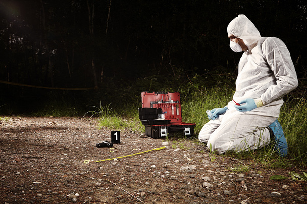 Crime scene technician at work on place - Foto, afbeelding