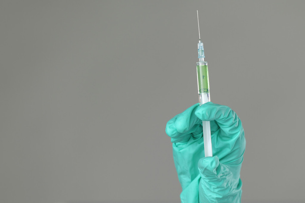 Syringe in hand - 写真・画像