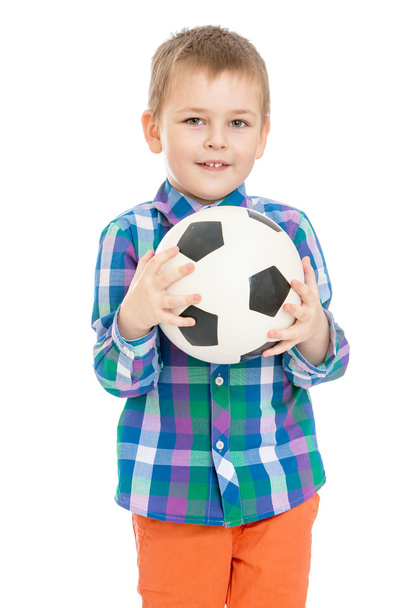 Little boy holding a soccer ball - Фото, изображение