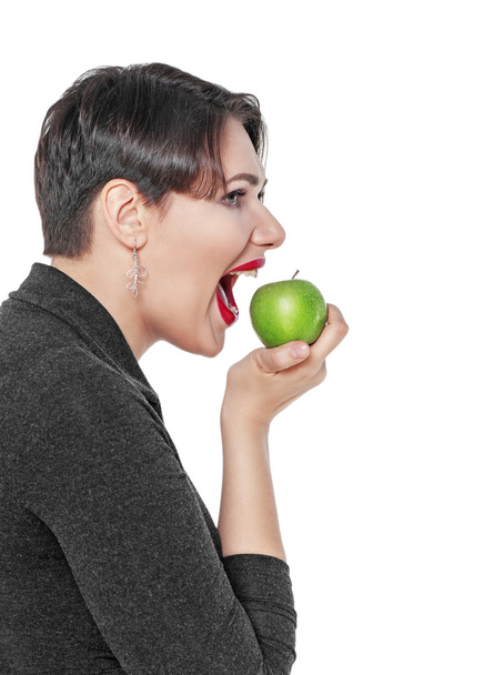 Beautiful plus size woman with green apple isolated - Photo, Image