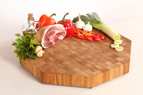 Meat on a chopping board - Фото, зображення