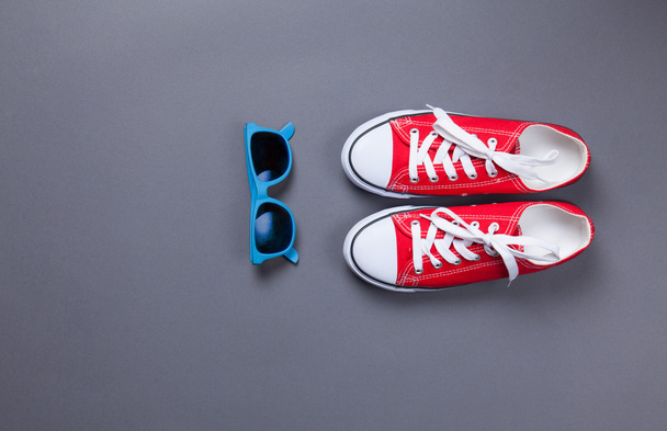 red gumshoes and sunglasses - 写真・画像