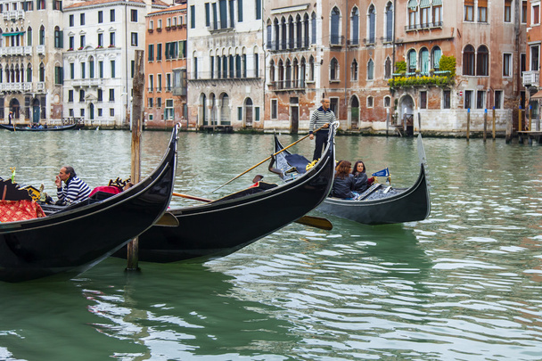 VENICE, ITALY - on APRIL 29, 2015. Two gondolas are moored at Grand kanal (Canal Grande) Embankment. - Foto, Imagem