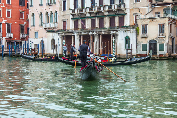 VENICE, ITALY - on MAY 1, 2015. Gondolas and trogetto with passengers float on the Grand channel (Canal Grande). - Photo, Image