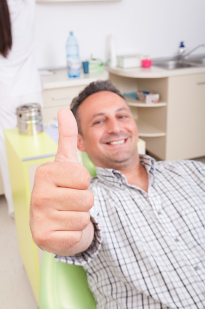 Relaxed patient on dentist chair showing like - Photo, Image