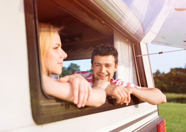 young couple travelling with camper van - Foto, Bild