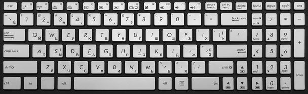 Modern black and chrome laptop keyboard isolated - 写真・画像