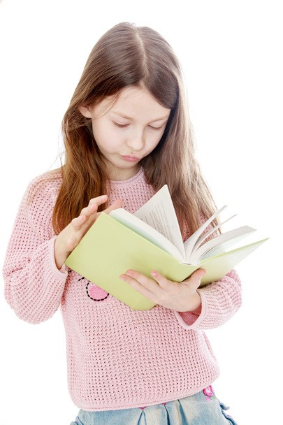 Smart long-haired girl reading a book, close-up - Fotó, kép