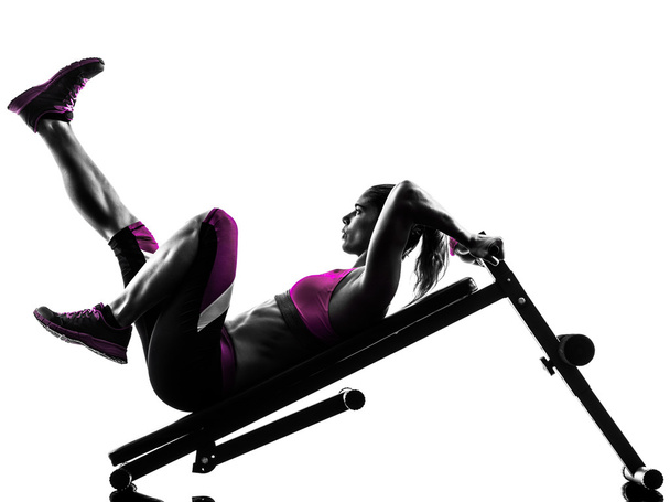 woman fitness  bench press crunches exercises silhouette - Foto, afbeelding