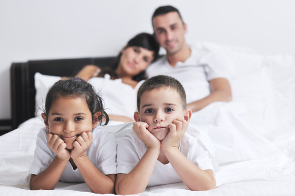 Happy young Family in their bedroom - Photo, Image