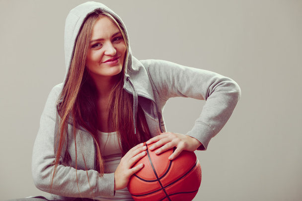girl  holding basketball. - 写真・画像