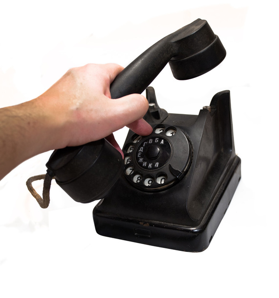 Vintage telephone being picked up  - Foto, Bild