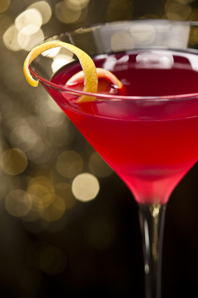 Cosmopolitan cocktail with lemon garnish - Photo, Image