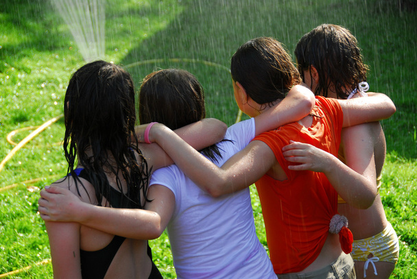 Group of girls and sprinkler - Fotografie, Obrázek