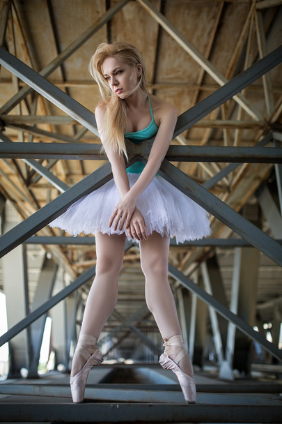 Graceful ballerina in the industrial background - Φωτογραφία, εικόνα