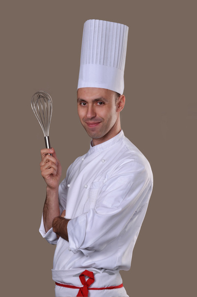 Cook holding a mixer. - Foto, Imagen