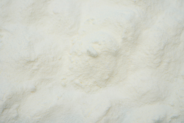 Powdered milk as background - Foto, afbeelding
