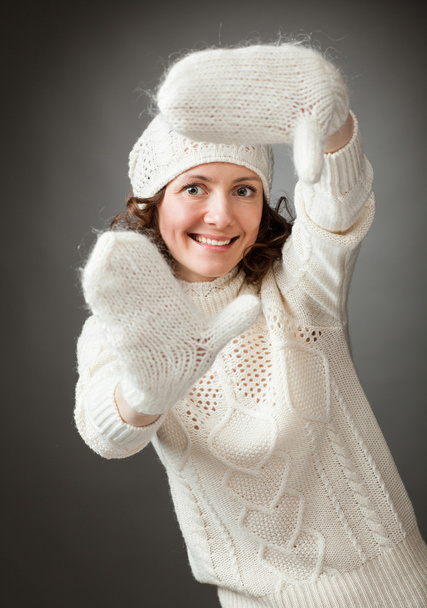 Portrait of happy young woman in white hat and mittens - Фото, изображение