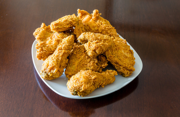 Fried Chicken in Square Plate on Polished Wood Table - Photo, Image