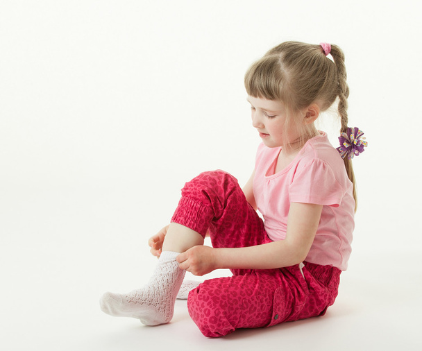 Girl trying on sock - Foto, immagini