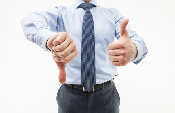 Businessman showing thumb down and thumb up - Фото, изображение