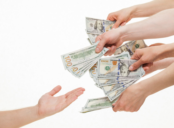 Hands put dollars in empty palm - Foto, immagini
