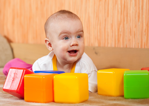 Baby plays with toy blocks - Fotó, kép