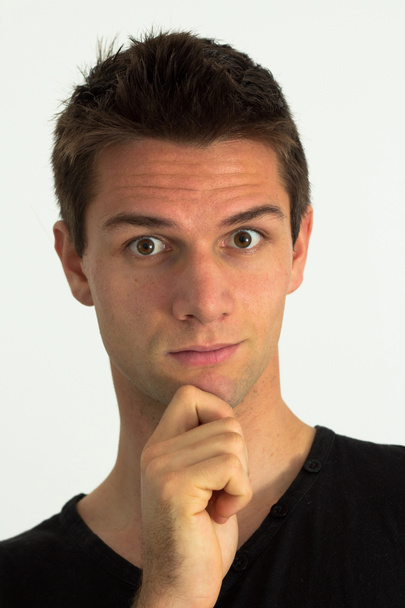 Man with hand on chin looking suprised and thinking - Photo, Image