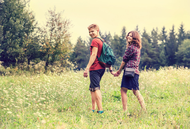 Young couple in summer forest - Foto, imagen