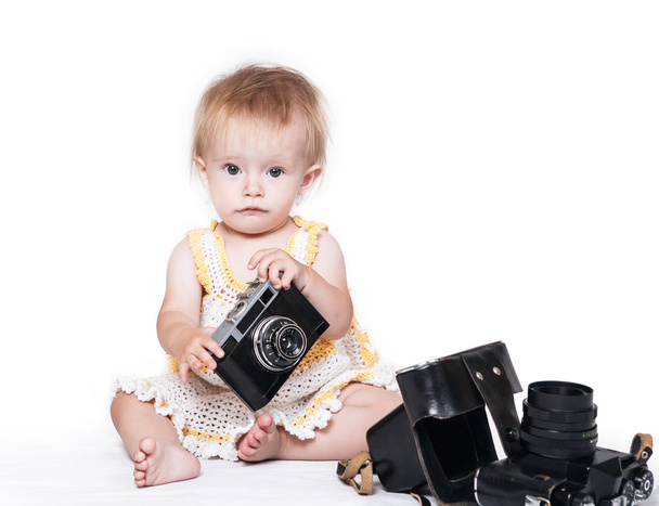 baby girl with retro  camera - Foto, afbeelding