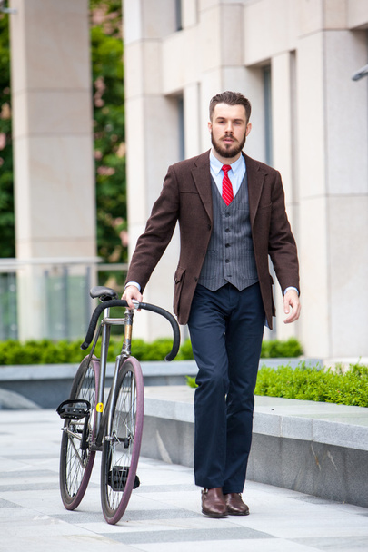 Handsome businessman and his bicycle - Фото, зображення