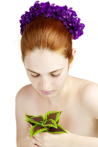 Beautiful girl with a plant in the hands of - Foto, Imagem