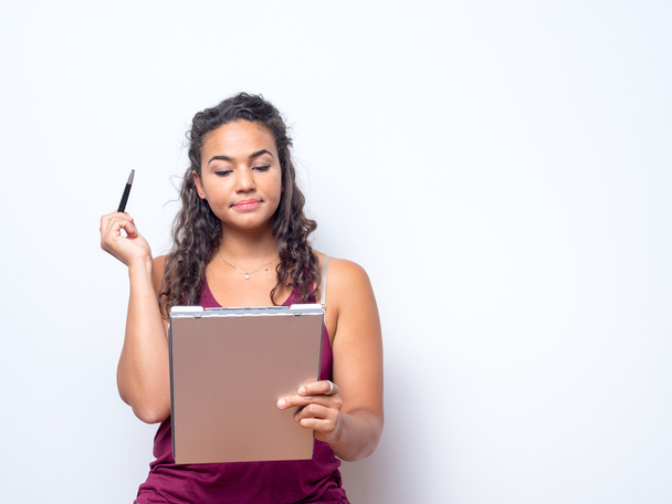 Attractive Woman Of Color Holds Clipboard - Foto, Imagen