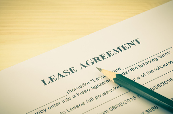 Lease Agreement Contract Document and Pencil at Bottom Right Corner Vintage Style - Photo, Image