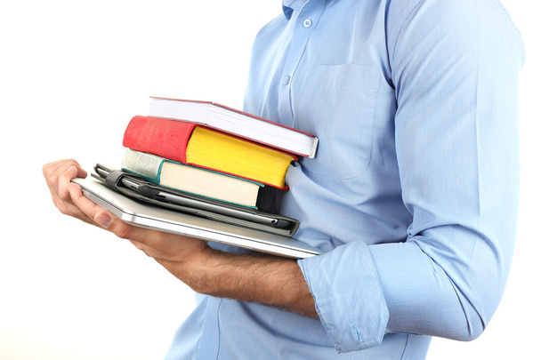 Man holding stack of books with laptop and tablet isolated on white - Foto, imagen