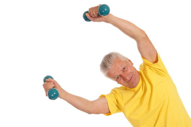 Old man with dumb bells on white - Foto, afbeelding