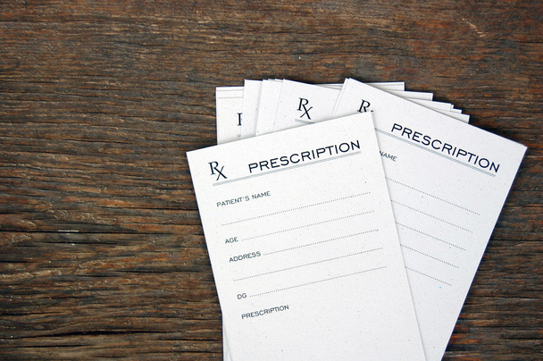 Blank prescriptions over wooden table - Foto, Imagen