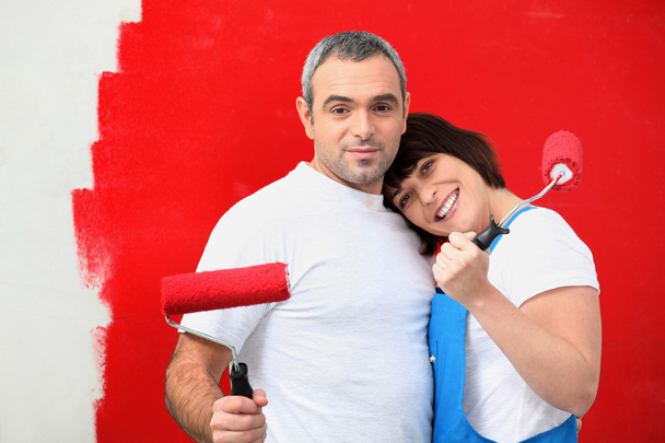 Couple painting wall red - Foto, Imagem