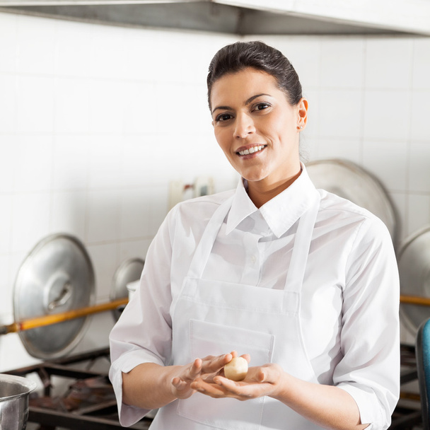 Smiling Chef Holding Pasta Dough Ball In Kitchen - Zdjęcie, obraz