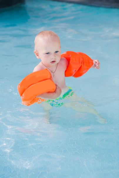 Cute little baby in swimming pool - 写真・画像