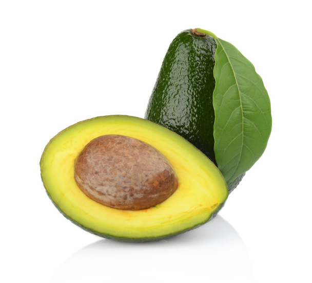 Studio shot of avocado with leaf and pit core isolated - Foto, Imagem