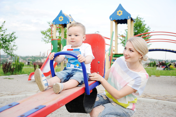 Mom and baby son play in the playground - Zdjęcie, obraz