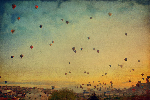 Grunge image  of colorful hot air balloons against blue sky - Photo, Image
