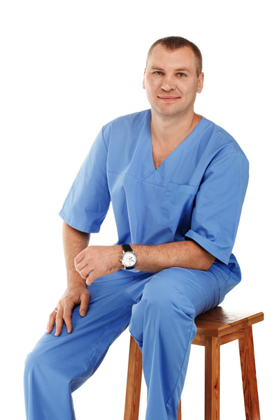 Portrait of a young male doctor in a medical surgical or lab blu - Photo, Image