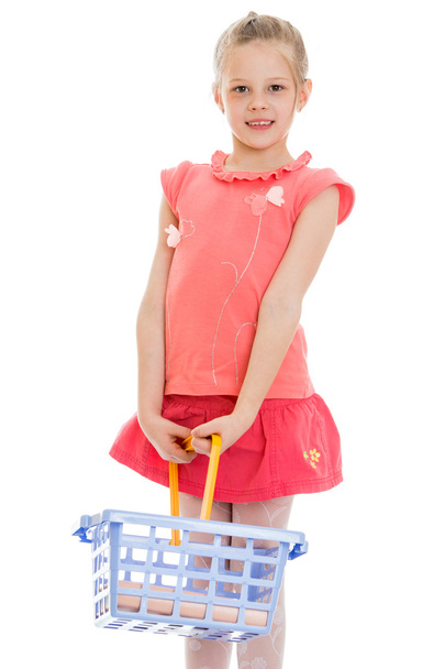 child with a shopping basket , close-up - Foto, imagen