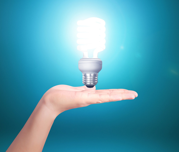 Creative light bulb idea in the hand - Фото, изображение