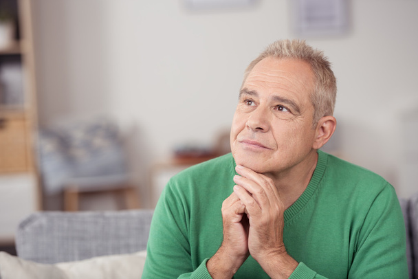 Thoughtful middle-aged man staring into space - Photo, image