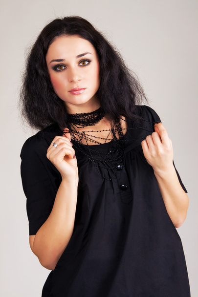 Pretty brunette in black clothing - Foto, Imagem